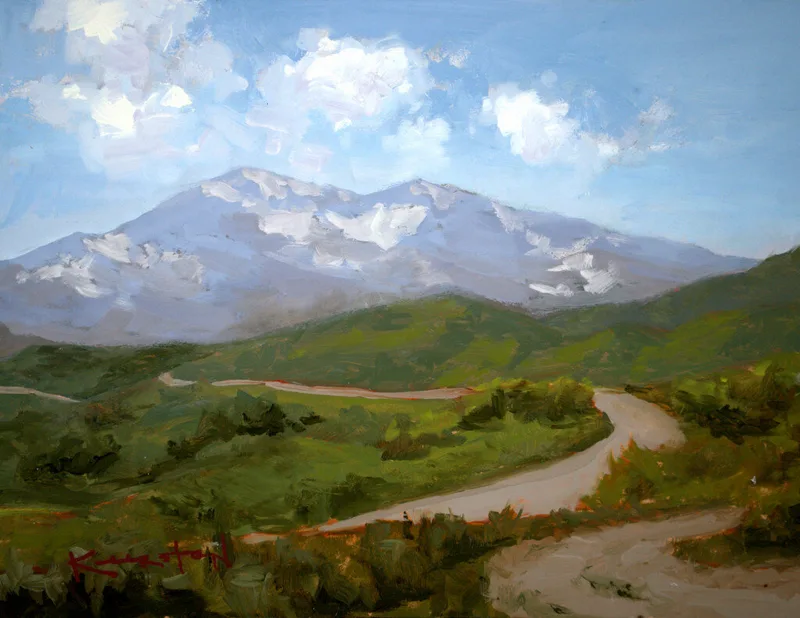 plein air landscape with snow-capped mountain green foothills and winding country road
