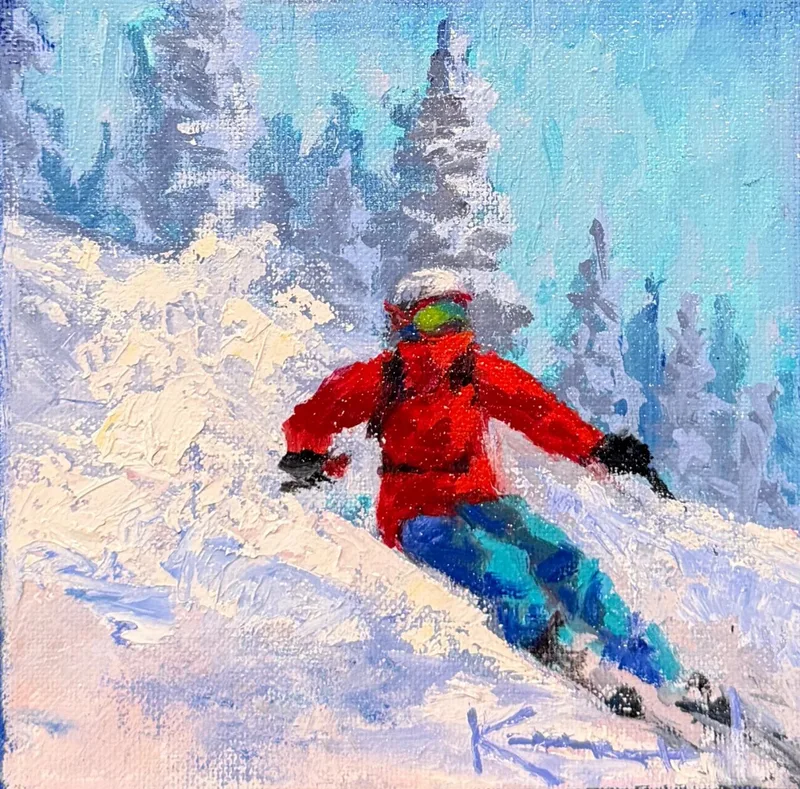 Skier in red jacket carving through snow with evergreen trees in background